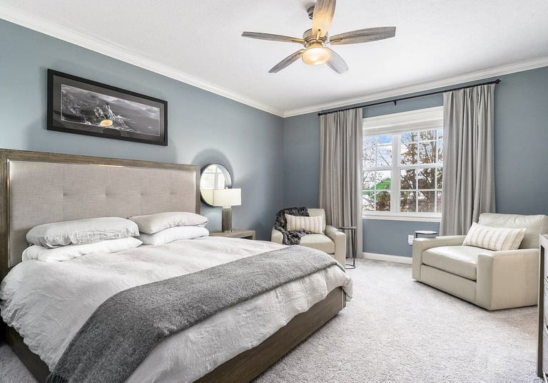a bedroom with a bed and a couch