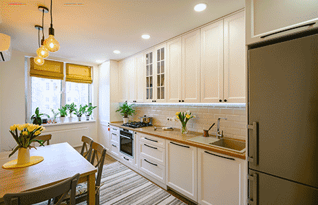 a kitchen with a table and chairs and a table