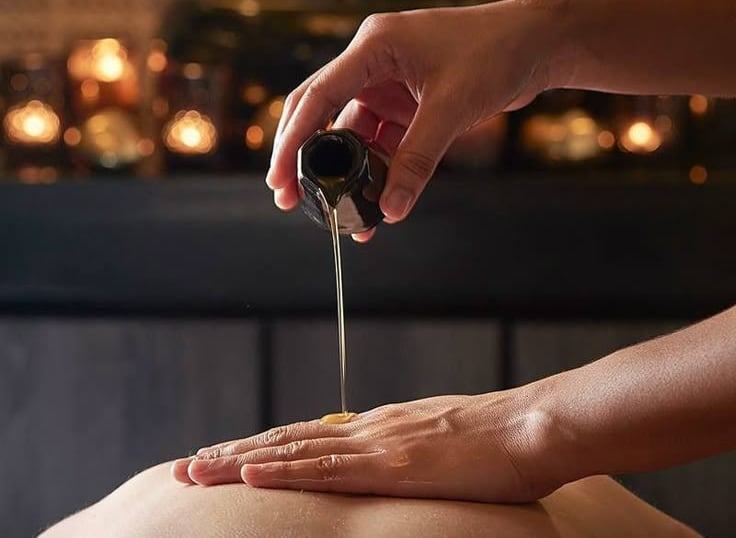 a woman getting a massage at a spa