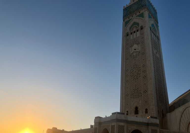 Stunning view of Hassan II Mosque in Casablanca at sunset, showcasing Islamic architecture