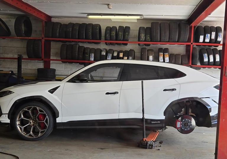 Urus getting wheel changed.