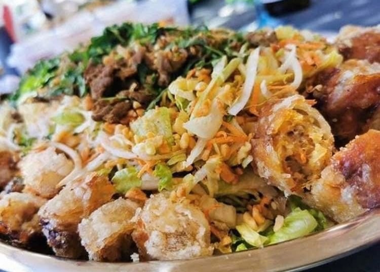 a plate of food with meat and vegetables