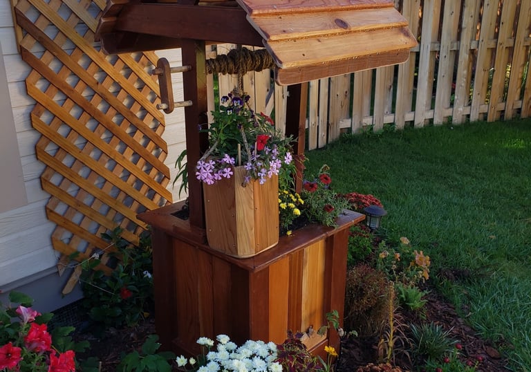 Custom made flower box made to resemble a working wishing well 