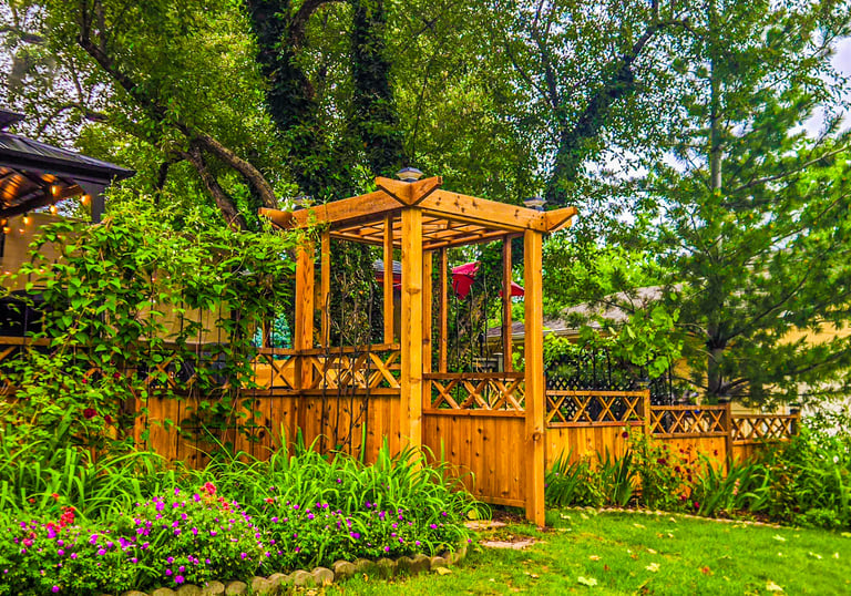 Custom wooden fence with custom made pergola