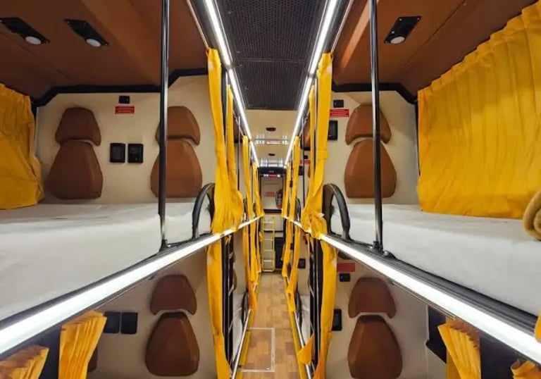 sleeper bus interior with comfortable berths for night travel in Delhi NCR