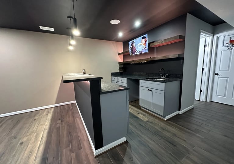 custom basement wet bar with black ceiling design.