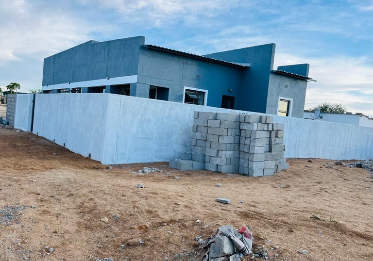 a house with a pile of rubble and rubble House Construction Frans-del Investment CC Construction com