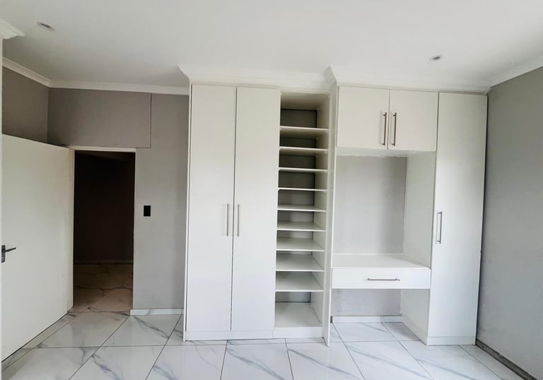 a room with a desk and a desk with a desk and a chair, House Construction Frans-del Investment CC Co