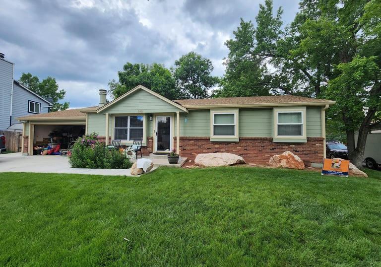 Two-tone residential exterior paint job in a Denver neighborhood.