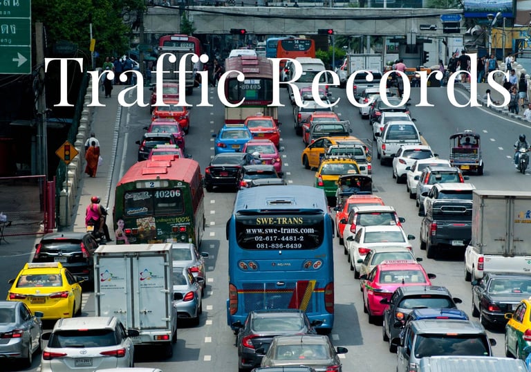 a bus is driving down a busy street - KamBri Solutions