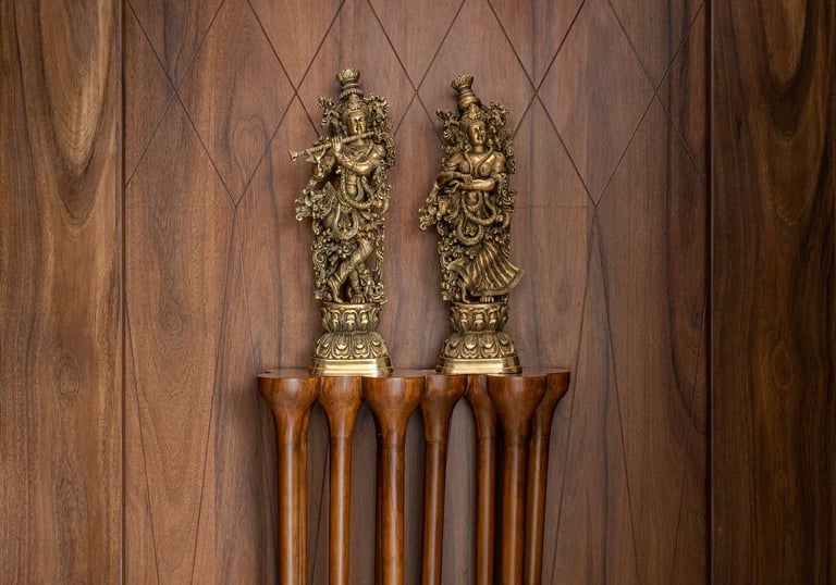 Custom wooden wall panel with decorative brass statues - Amuk Modular interior design Pune