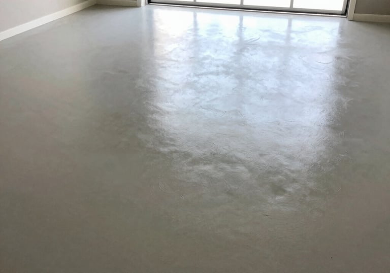 a man riding a skateboard down a street next to tall buildings