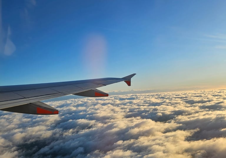 Passenger on a plane overlooking clouds melatonin consultation Aberdeen City Centre