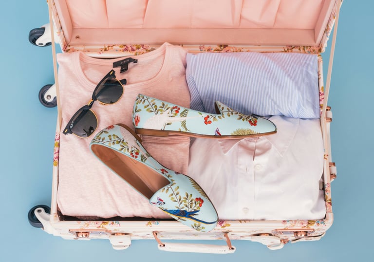 Open suitcase packed for a holiday — period delay service in Aberdeen