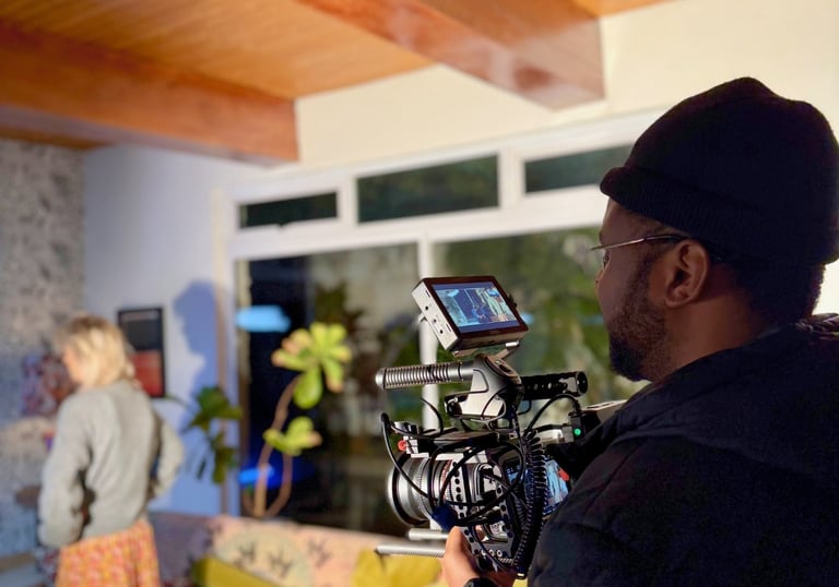 Daniel da Trindade filming behind the scenes during a music video shoot at Porch Time Records.