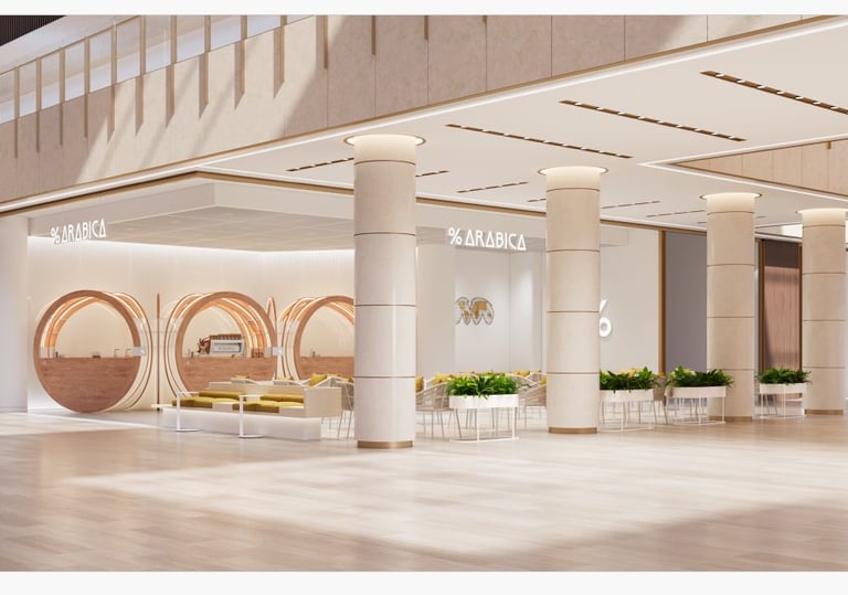 Modern Arabica coffee shop interior featuring minimalist circular pods and bright open seating.