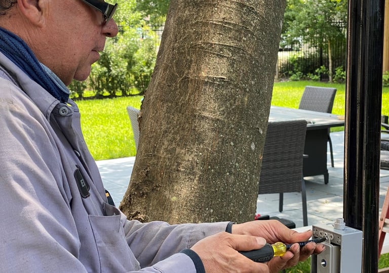 landscape lighting technician installing a dimmer switch