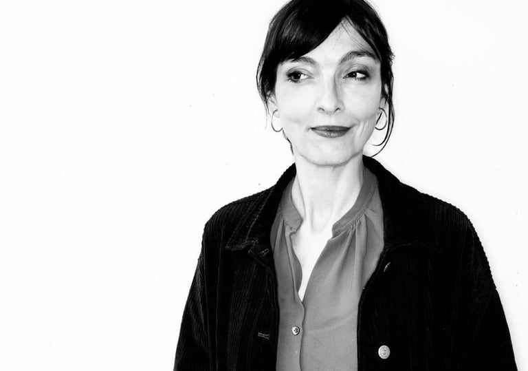 a woman with a black jacket and a black and white photo