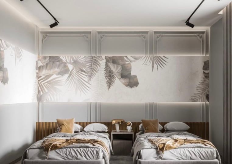 a bedroom with two beds and a wall mural Nour Nagy Designs
