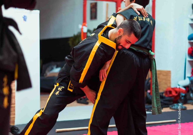 a man in a black suit and a man in a yellow jacket