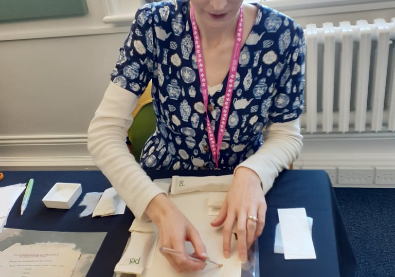 Mandy conserving a paper document