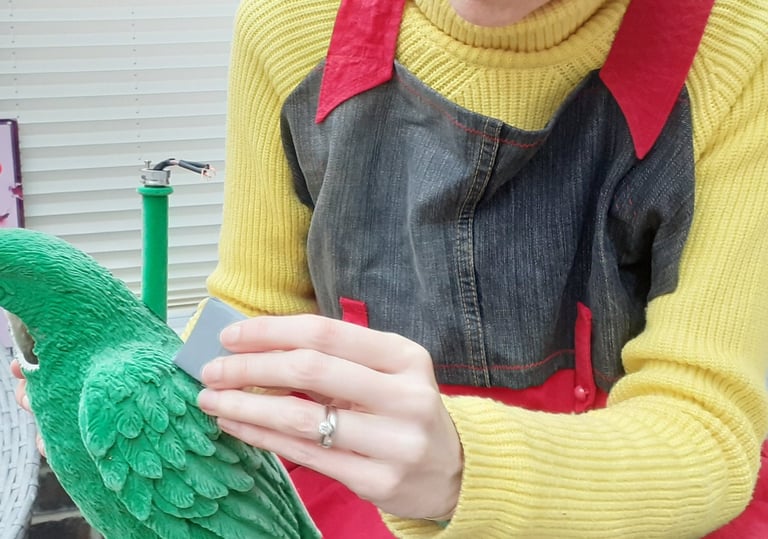 Mandy cleaning a plastic lamp base
