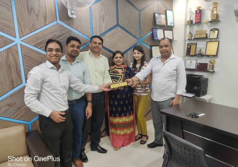 a group of people standing around a table