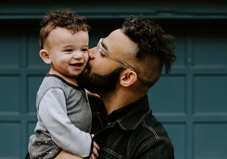 a man with a beard and glasses on his face and happy to show personal loans