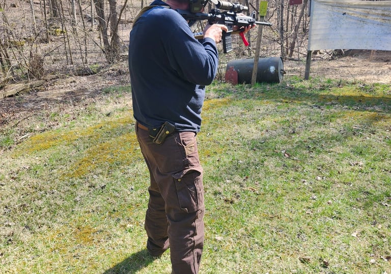 Man using self-defense firearm (Carbine) on range.