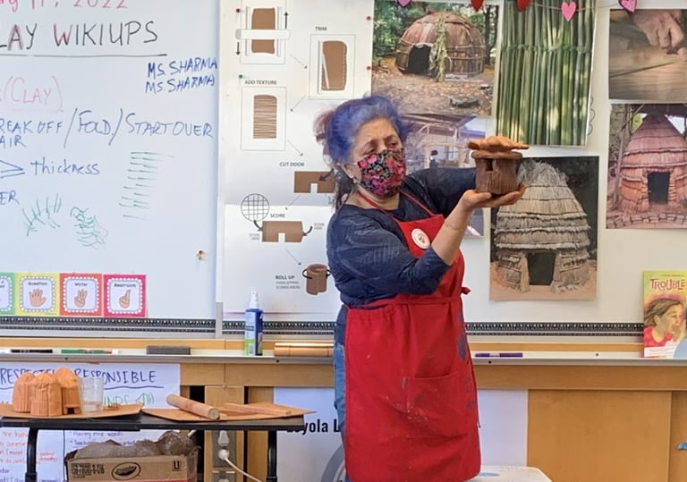 docent teaching a clay lesson