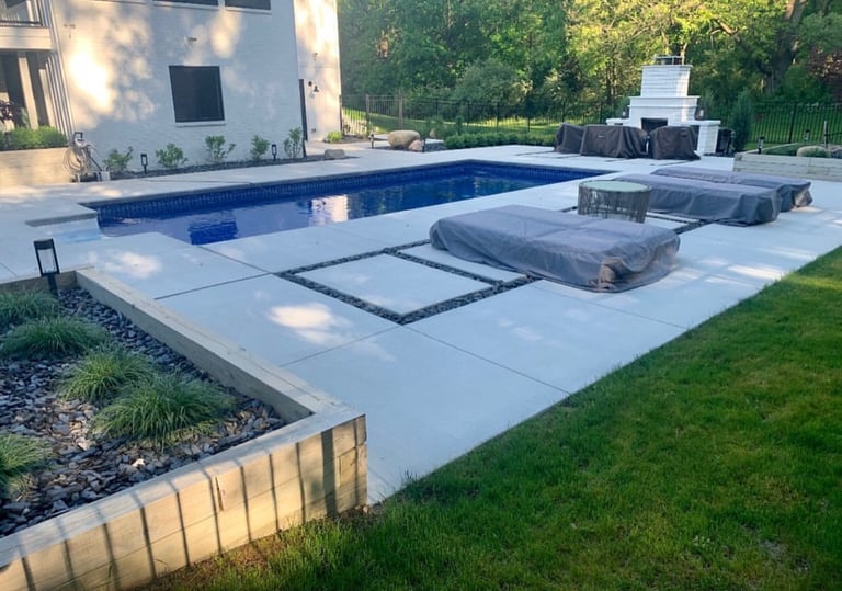 Leppek Landscapes designed and installed modern patio around in ground pool.