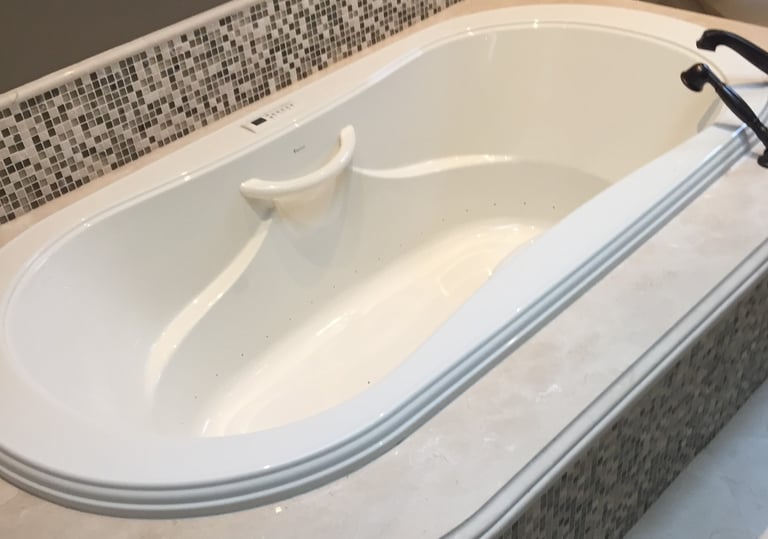 beautifully repaired marble bathtub surround
