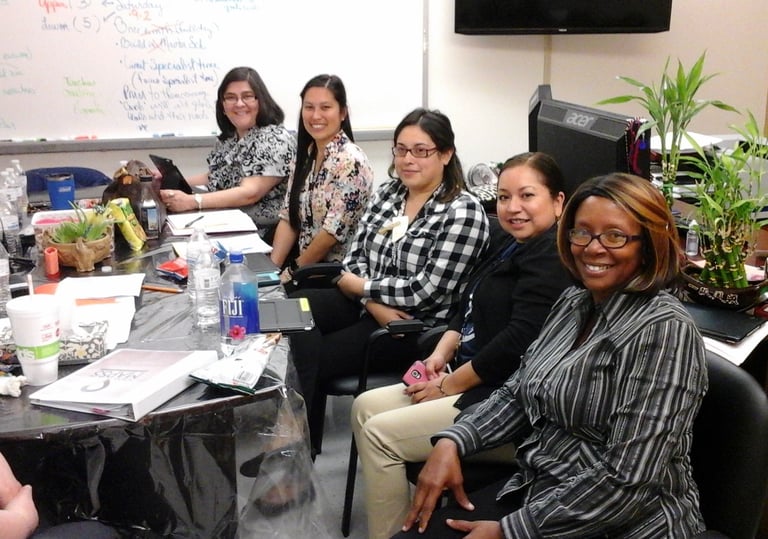 Patricia Clarkson collaborating during a workshop with a group of young women
