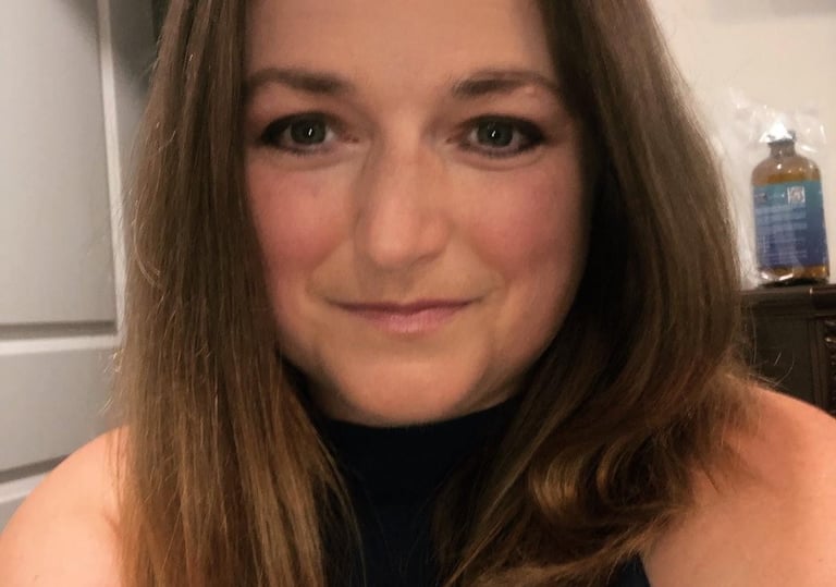 a woman with a blue dress and a black top