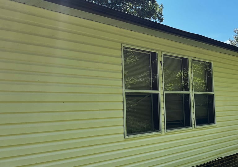 After: spotless white vinyl siding on Lenoir NC house—soft wash removes all grime, mildew-free and bright