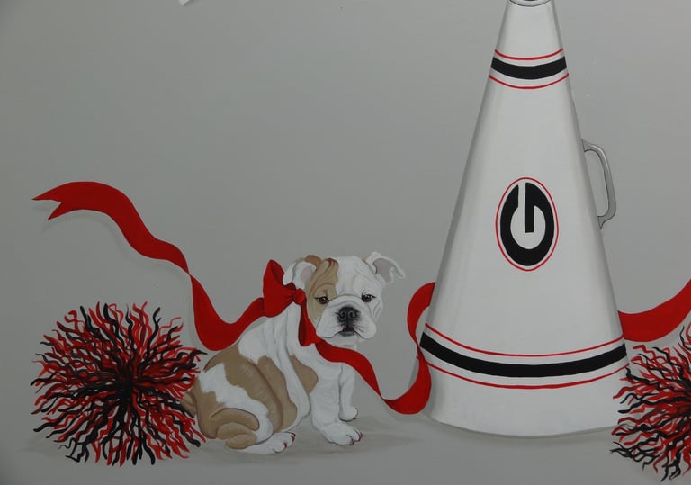 English Bulldog puppy mascot art with a red bow, cheerleader pom-poms, and megaphone.
