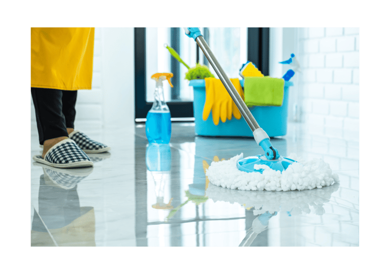a person cleaning a floor with a mop