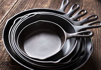 “Different cast iron skillet sizes displayed together