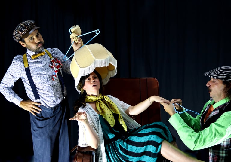 a man and woman in costumes on stage