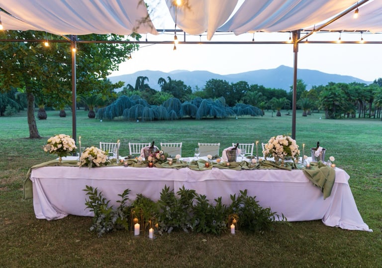 wedding table with a table cloth and candles