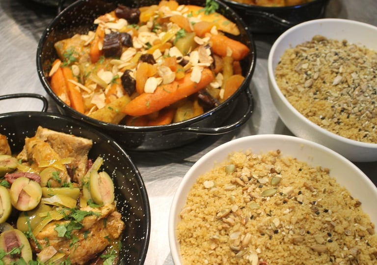 a table with bowls of mediterranean