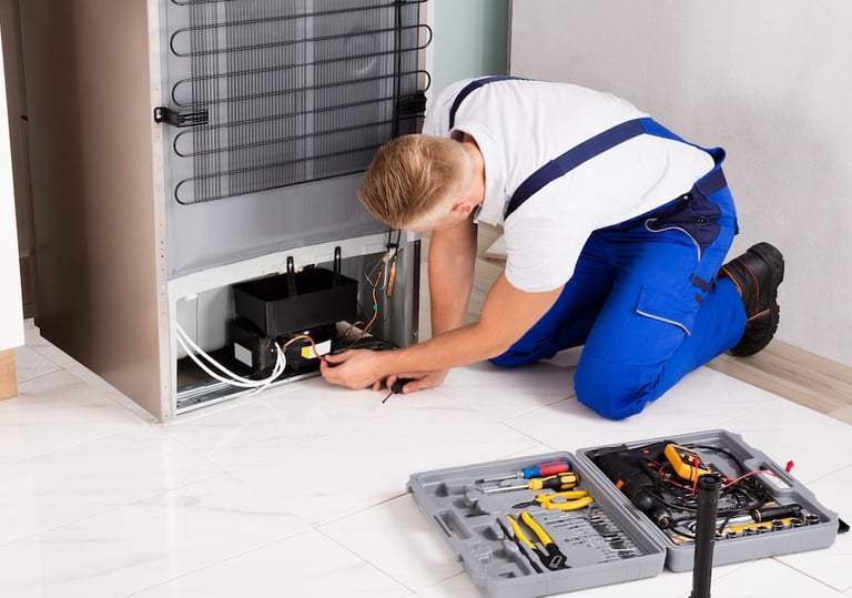 a technician repairing a compressor of a refrigerator