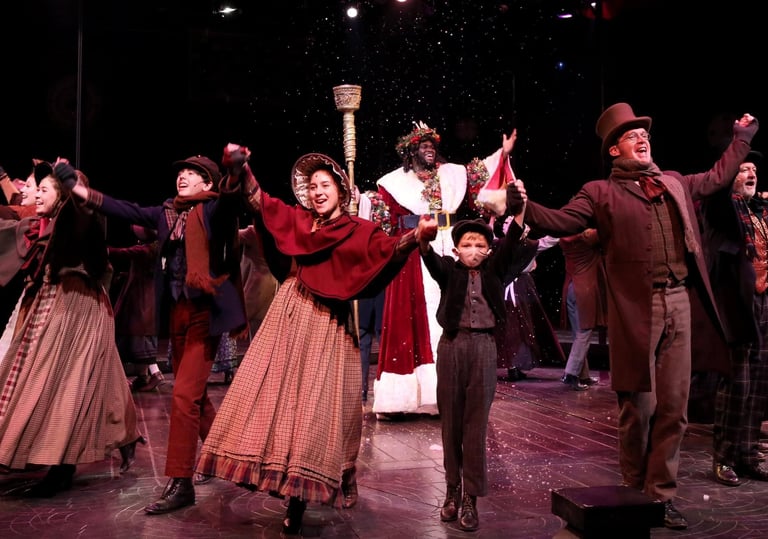 a group of people standing on a stage dancing