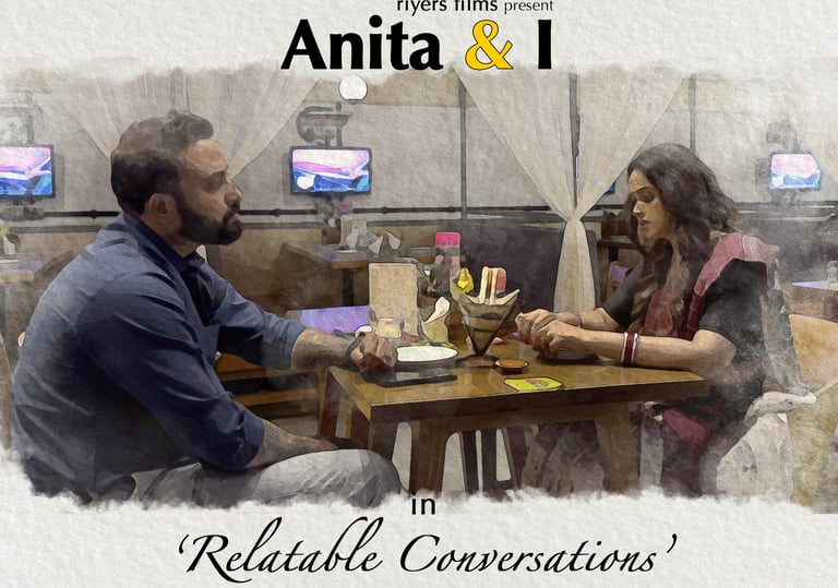 a man and woman sitting at a table with a man in a blue shirt