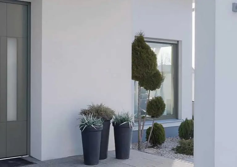 Porte d'entrée bois aluminium haut de gamme sur façade moderne à Castelnau par LB Menuiserie