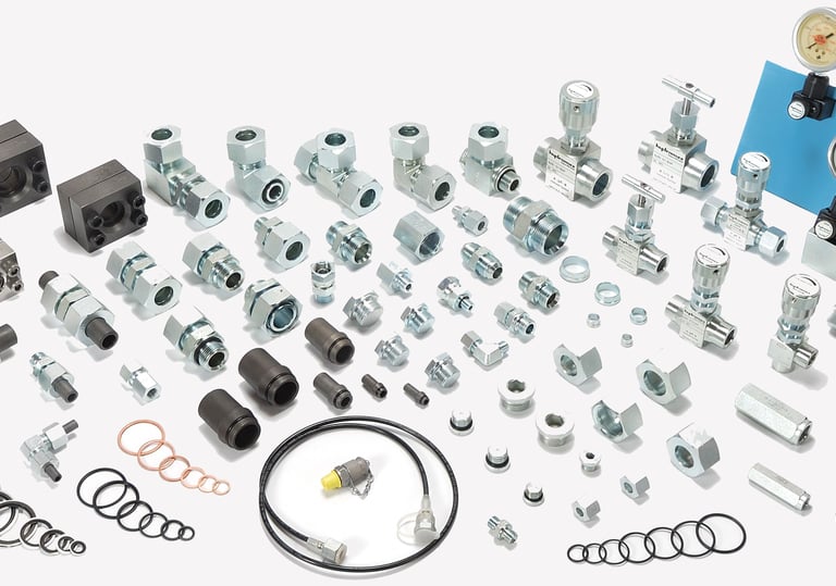 Photograph of hydraulic Ermetto fittings & accessories, versatile components utilized in hydraulics