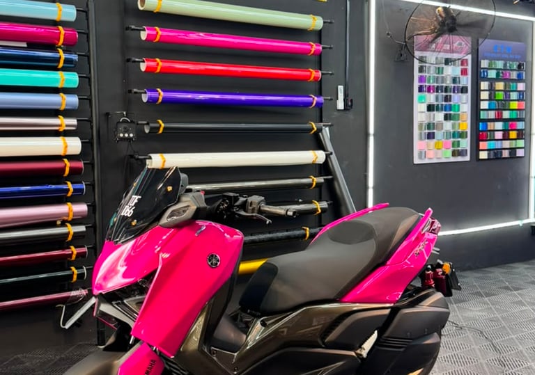 Yamaha XMAX scooter wrapped in gloss pink vinyl finish