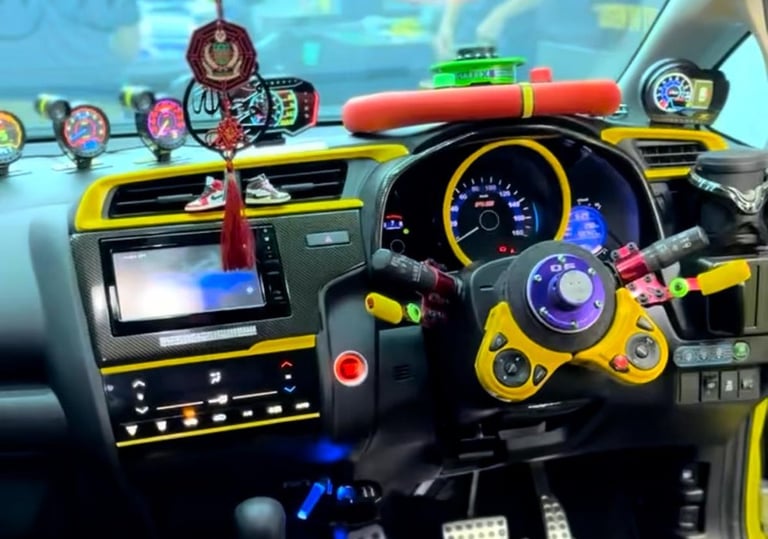 Custom car interior wrap with yellow carbon fiber dashboard trim