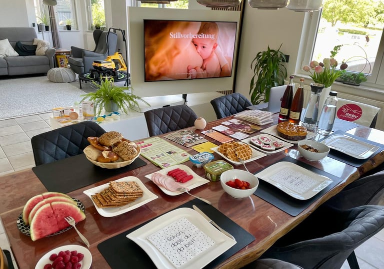 a table with plates of food and drinks