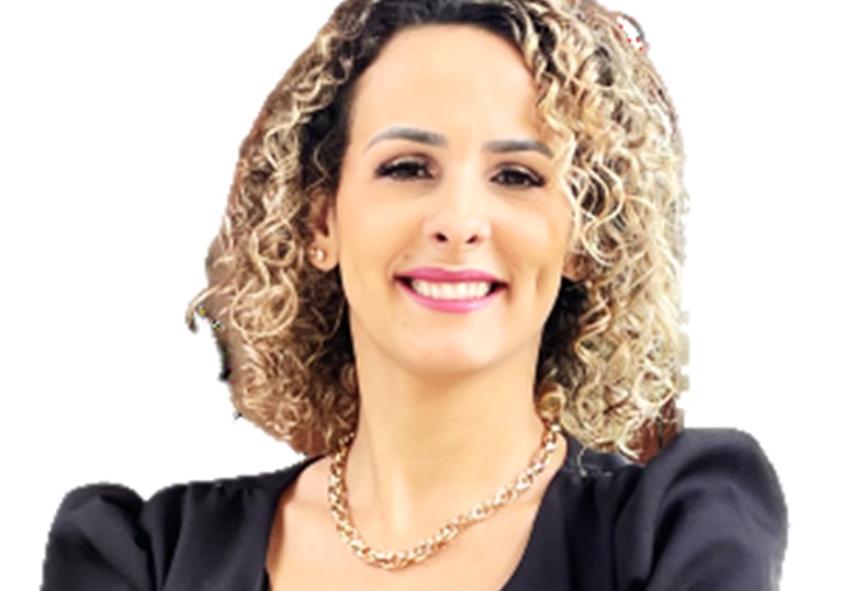 a woman with curly hair and a black jacket